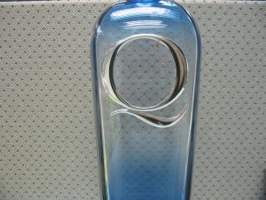 Q Medallion on bottle